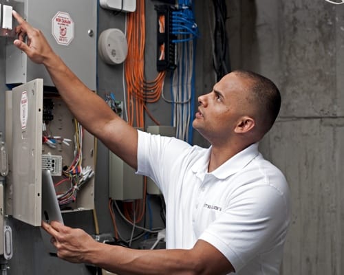 property manager inspecting electrical panel