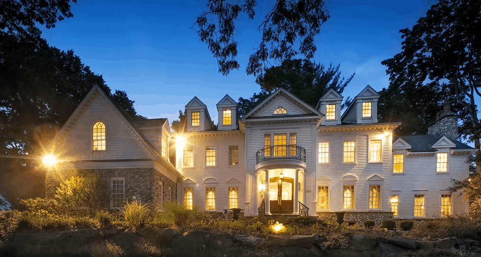 Large home at night with electrical services
