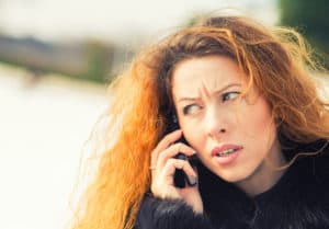 unhappy woman on phone