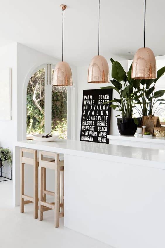 Gorgeous copper pendants show off kitchen