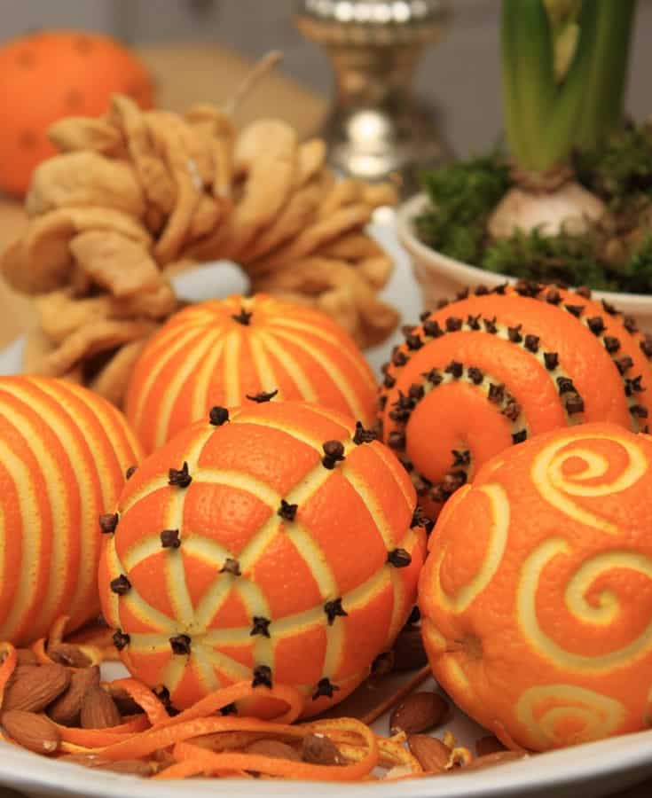 oranges carved for festive holiday tabletop arrangement
