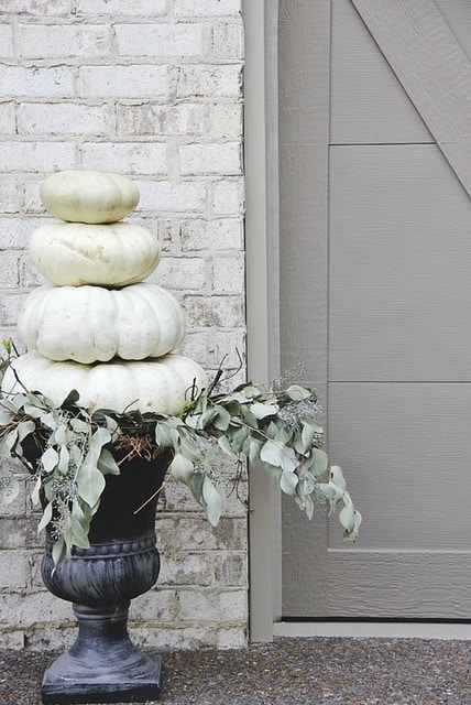 white Cinderella pumpkins adorn front door