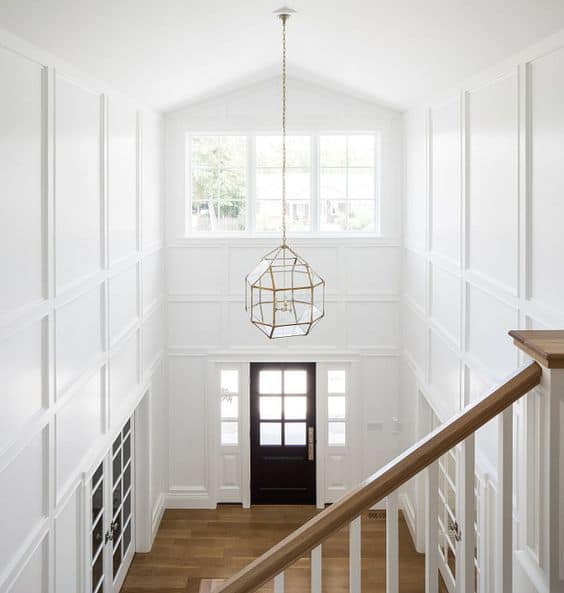 Using wood panelling in foyer creates dramatic design statement