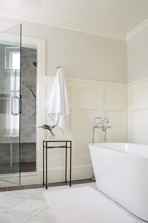 shaker style wood panelling in bathroom halfway up to ceiling