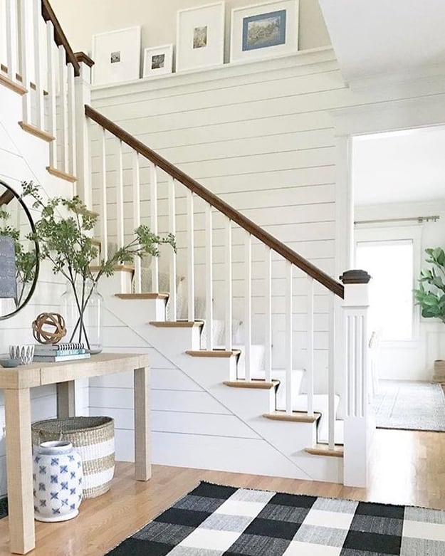 shiplap horizontal wood panelling near entranceway