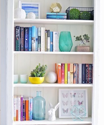 bookshelves organized by color