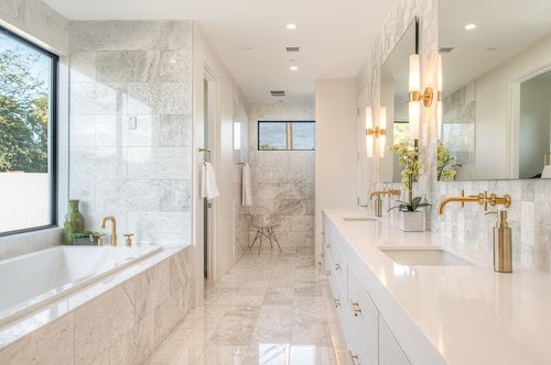 bathroom with brass metal cabinet pulls