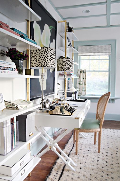 A small writing table can also work as a vanity in a guest bedroom. A futon or sofa bed can add comfort when your space is in “office mode” and transition for when guests come over.