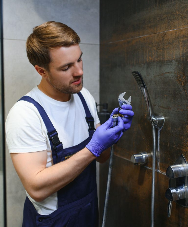 professional handyman working shower booth indoors 768x925 professional handyman working shower booth indoors 768x925